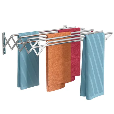 A wall-mounted, expandable drying rack with several towels hanging on it.