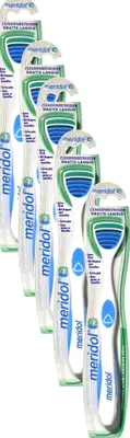 A group of Meridol tongue cleaners are displayed in their packaging.