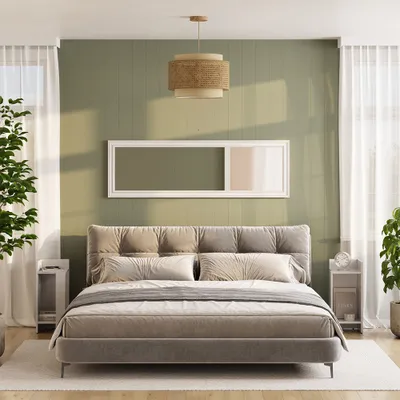 A bedroom scene with a bed, nightstands, and a large framed picture on the wall.