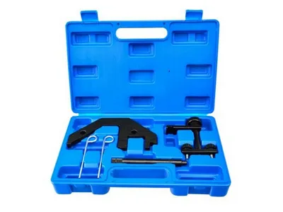 A blue plastic toolbox containing various black metal automotive tools.