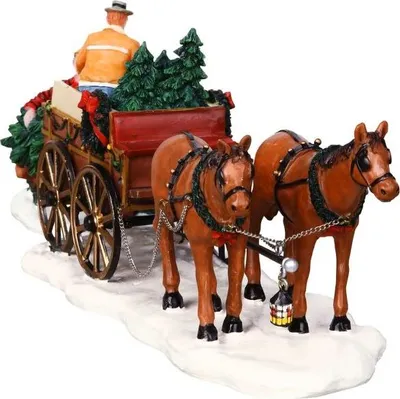 A Christmas-themed decorative piece featuring a horse-drawn wagon filled with Christmas trees and a driver.