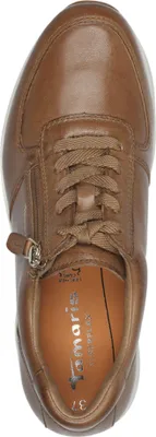 A top-down view of a brown leather sneaker.