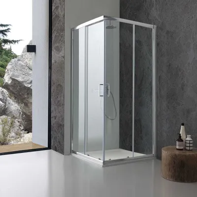 A modern bathroom with a glass shower enclosure.