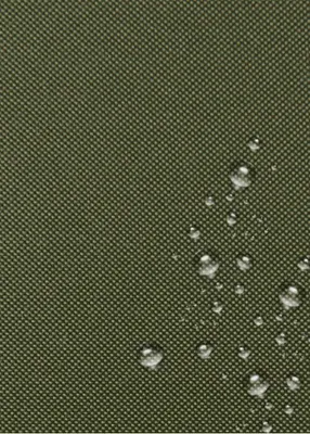 A close-up view of a green fabric with water droplets on it.