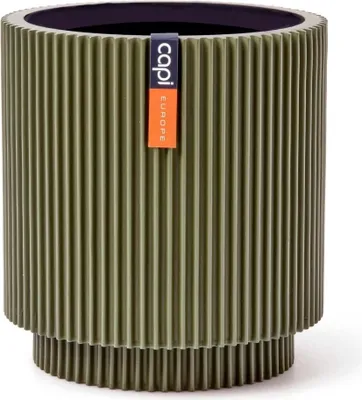 A green cylindrical planter with a ribbed texture and a black interior, featuring a brand tag.