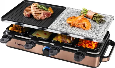 A raclette grill with food on it, shown from a diagonal angle.