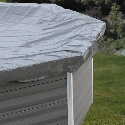 A close-up view of a gray tarp covering the top of an above-ground swimming pool.