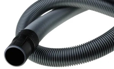 A close-up shot of a gray, ribbed vacuum cleaner hose with a black connector on a white background.