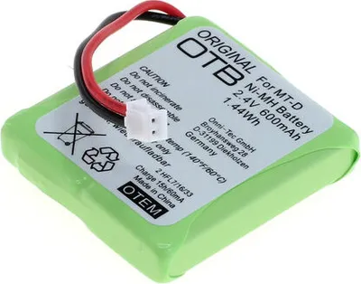 A close-up, slightly angled view of a green rechargeable battery pack with a white label and a white connector with red and black wires attached.
