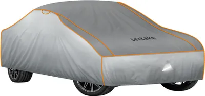 A car covered with a gray protective cover.