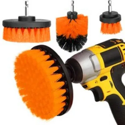 A collection of drill brush attachments and a power drill.