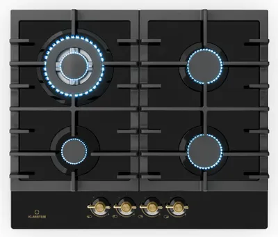 A top-down view of a black gas stovetop with four burners, two of which are lit with blue flames. The stovetop has a black glass surface and a black control panel with four gold knobs.