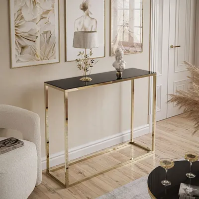 A modern living room scene featuring a console table with decorative items and artwork.