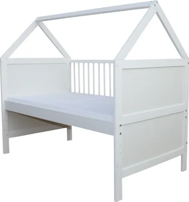 A white baby bed with a house-shaped frame and a mattress.