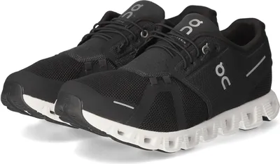A pair of black and white On Running Cloud 5 men's running shoes.