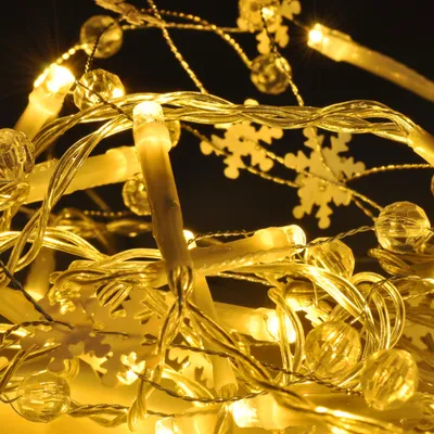 Zdjęcie produktu dla Łańcuch LED Solight 2m, 20 ciepłobiałych diod LED, 60 dekoracji, zasilanie bateryjne