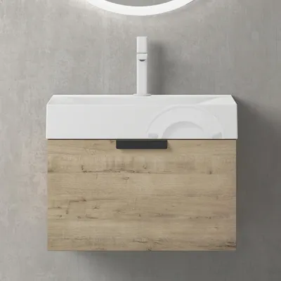 A modern bathroom vanity with a white sink and a wood-grain drawer, mounted on a concrete wall.