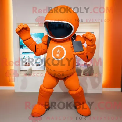 Produktbild von Orangefarbener REDBROKOLY American Football Helm Maskottchen Kostüm Charakter gekleidet in eine Yoga-Hose und Smartwatches