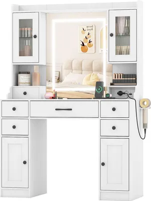 A white vanity table with a lighted mirror and various storage compartments.