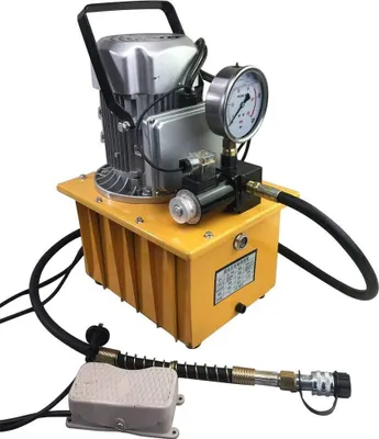 A hydraulic pump with a pressure gauge and foot pedal, isolated on a white background.