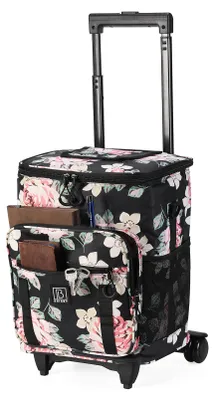 A floral patterned rolling shopping trolley with a telescopic handle and wheels.