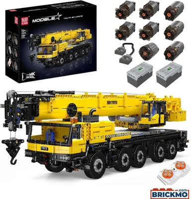 A detailed product shot of a large yellow and black toy crane, with its box and components displayed.