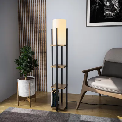 A floor lamp with shelves is placed next to a chair and a plant in a room.