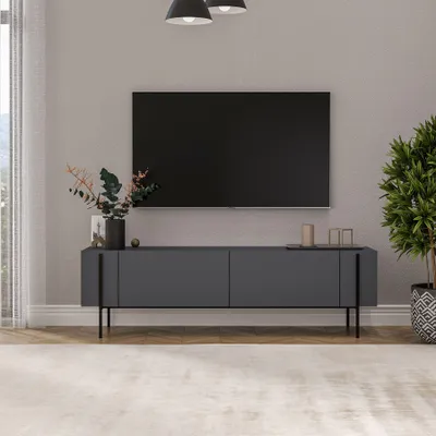 A modern living room with a TV stand and television.