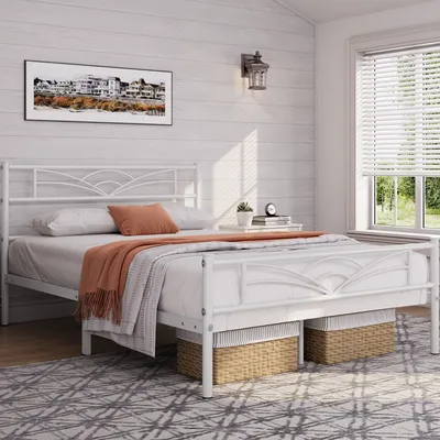A bedroom scene with a white metal bed frame, bedding, and decorative elements.