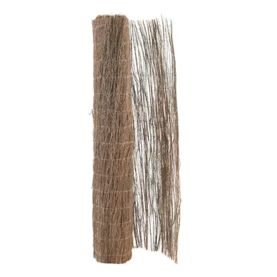 A rolled-up fence made of natural fibers, partially unrolled to show its texture.