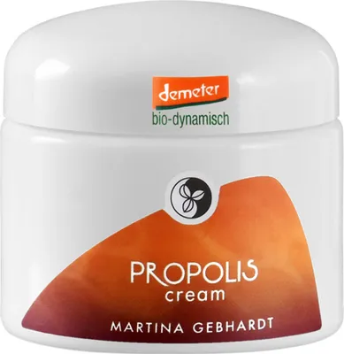 A white jar of Martina Gebhardt Propolis cream with orange and brown branding.