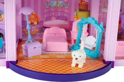 A dollhouse interior with furniture and accessories.