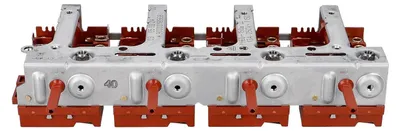 A close-up, angled view of a multi-gang electrical switch or regulator block.