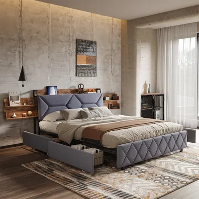 A bedroom scene featuring a bed with storage drawers and a headboard with integrated USB ports, set against a concrete wall.