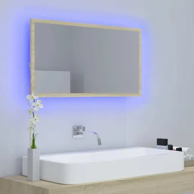 A modern bathroom vanity with a rectangular sink and a LED-lit mirror.