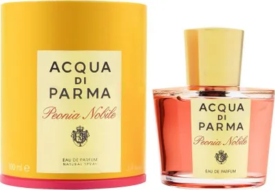 A perfume bottle and its cylindrical packaging are displayed side-by-side against a white background.