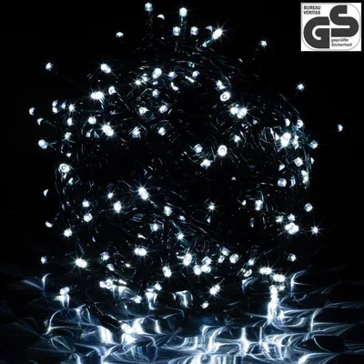 A tangled ball of white LED string lights against a black background.