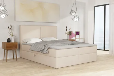 A bedroom scene with a bed, nightstand, and artwork.