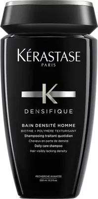 A black bottle of Kerastase shampoo for men.