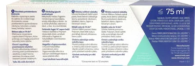 The image shows the side panel of a toothpaste box with text in multiple languages.