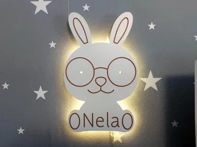Immagine prodotto di Luce notturna a LED a forma di coniglio alimentata a batteria con nome