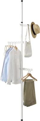 A floor-standing telescopic coat rack with clothes and a hat hanging on it.