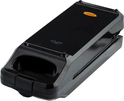 A black Adler sandwich maker is shown from a diagonal angle against a white background.