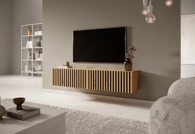 A modern living room with a wall-mounted TV stand and television.