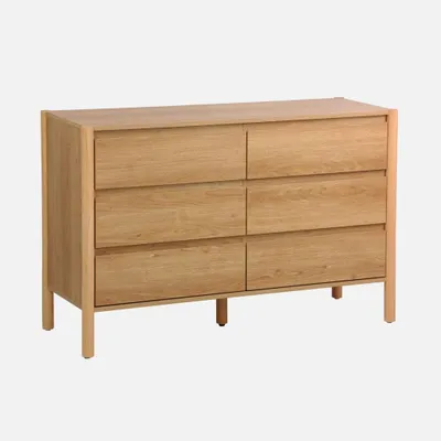 A wooden dresser with six drawers against a white background.