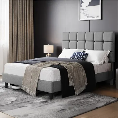A bedroom scene with a bed, curtains, and a lamp.