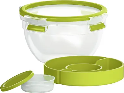 A clear studio shot of a transparent salad container with a green lid and a green divided insert.