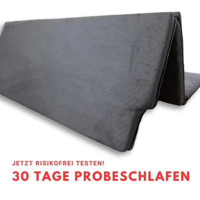 A folded mattress on a white background with promotional text.