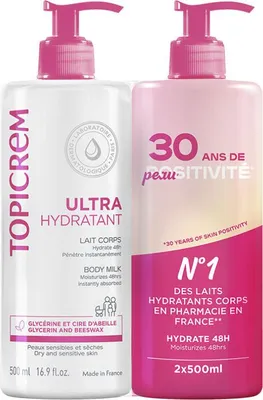 Two bottles of Topicrem body milk are shown side-by-side against a white background.