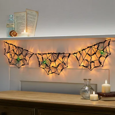Produktbild von LED-Spinnennetz-Lichterkette, schwarz, für Halloween-Partys, zum Aufhängen – Dekoration, batteriebetrieben, mit Timer, 0,9 m, für den Innenbereich